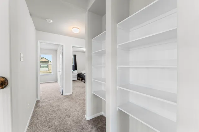 a view of a hallway with closet