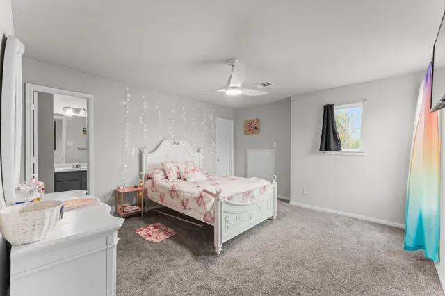 a bed room with a bed and a table