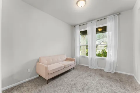 a living room with furniture and a window