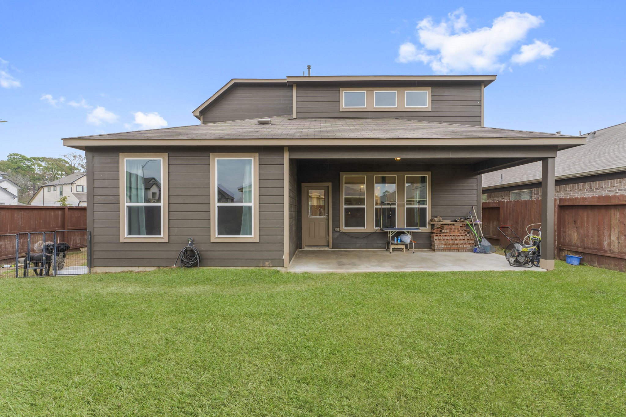 11331 Painted Trillium Lane Houston, TX 77044 - Photo 33 of 38 a front view of a house with a garden and porch