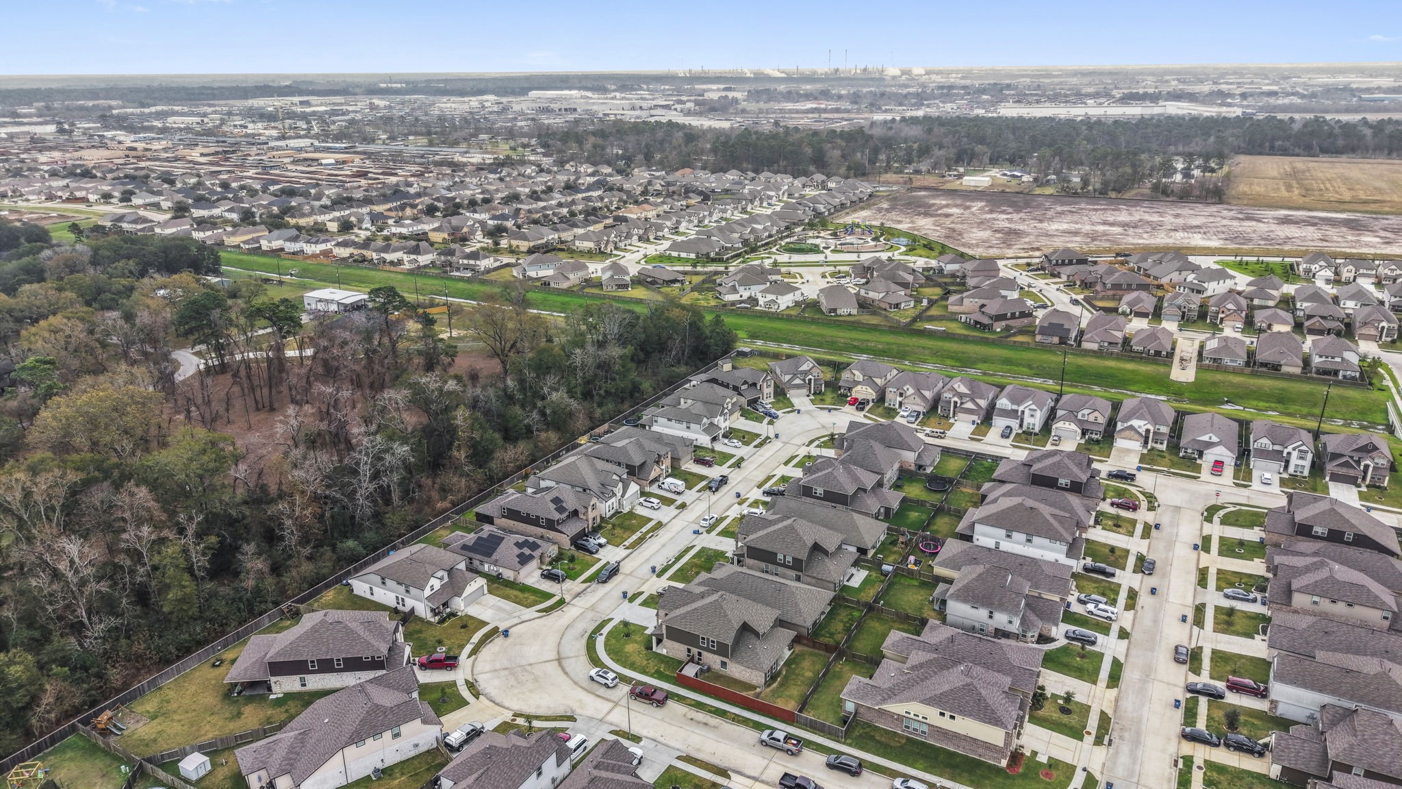 11331 Painted Trillium Lane Houston, TX 77044 - Photo 37 of 38 an aerial view of residential building and lake view