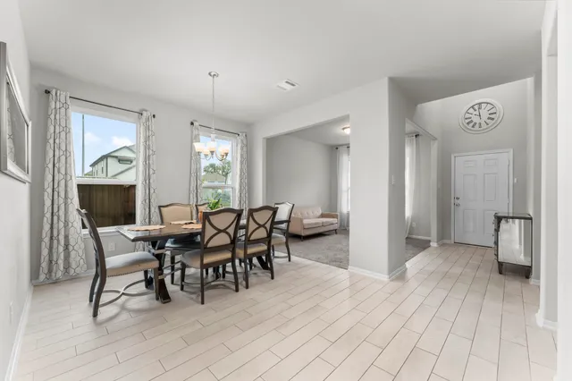 a view of a dining room with furniture