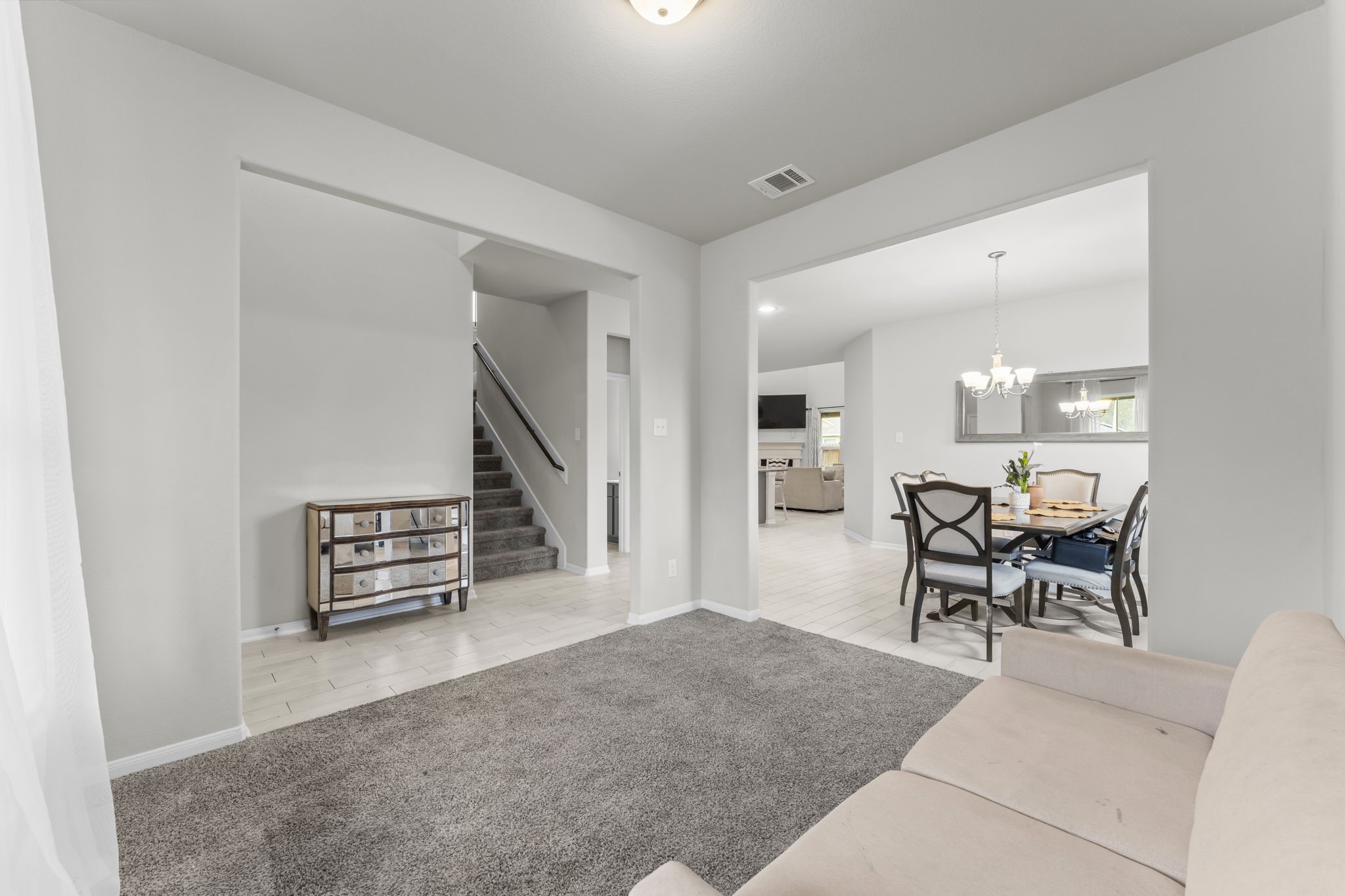 11331 Painted Trillium Lane Houston, TX 77044 - Photo 7 of 38 a living room with furniture and a wooden floor