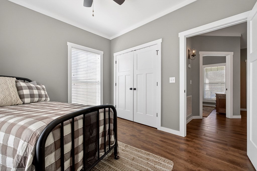 6081 Buck Mountain Road Cookeville, TN 38506 - Photo 21 of 78 a bedroom with a bed and wooden floor
