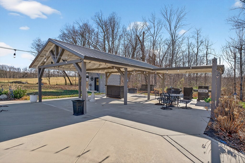 6081 Buck Mountain Road Cookeville, TN 38506 - Photo 28 of 78 a view of a house with sitting area and garden