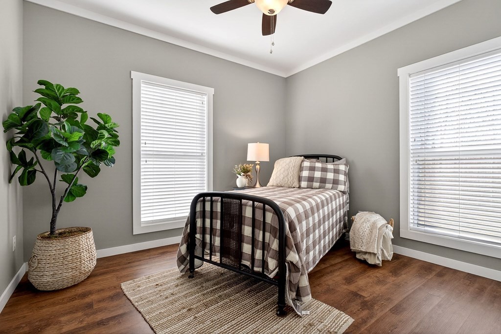 6081 Buck Mountain Road Cookeville, TN 38506 - Photo 35 of 78 a bedroom with a bed and a potted plant