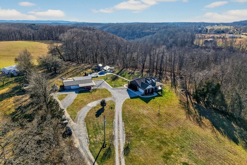 6081 Buck Mountain Road Cookeville, TN 38506 - Photo 45 of 78 a view of a swimming pool with a yard and mountain view