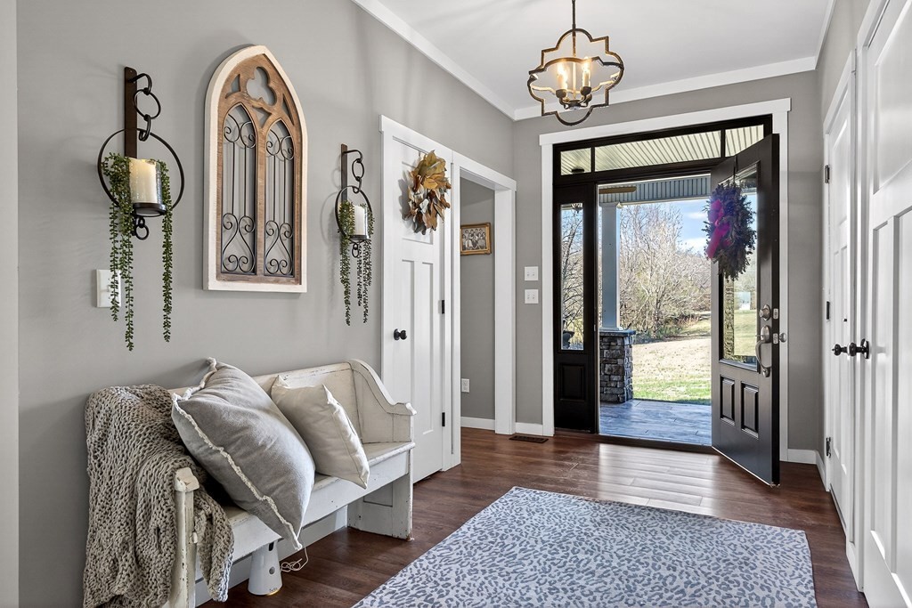 6081 Buck Mountain Road Cookeville, TN 38506 - Photo 5 of 78 a living room with furniture a window and a chandelier