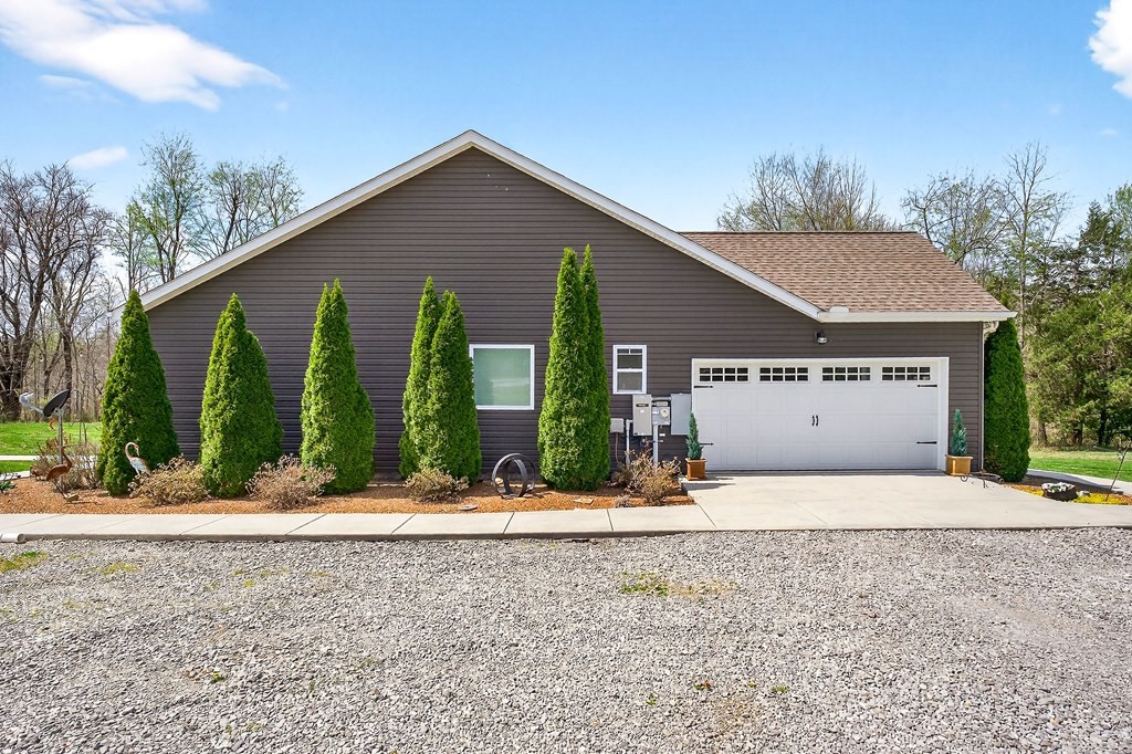 6081 Buck Mountain Road Cookeville, TN 38506 - Photo 73 of 78 a front view of a house with a yard and potted plants