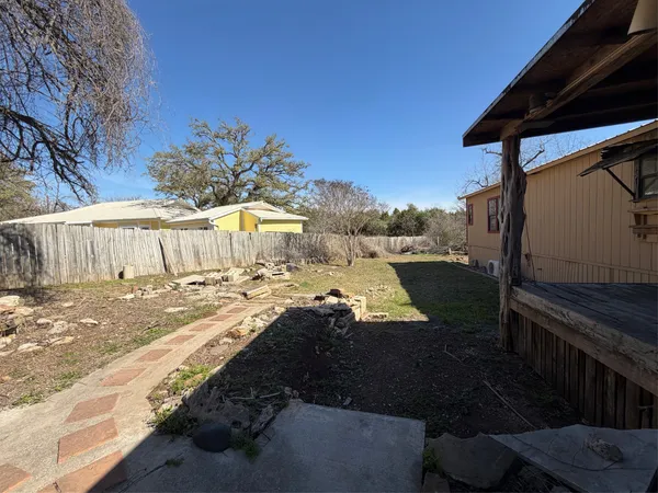 a view of a backyard of the house