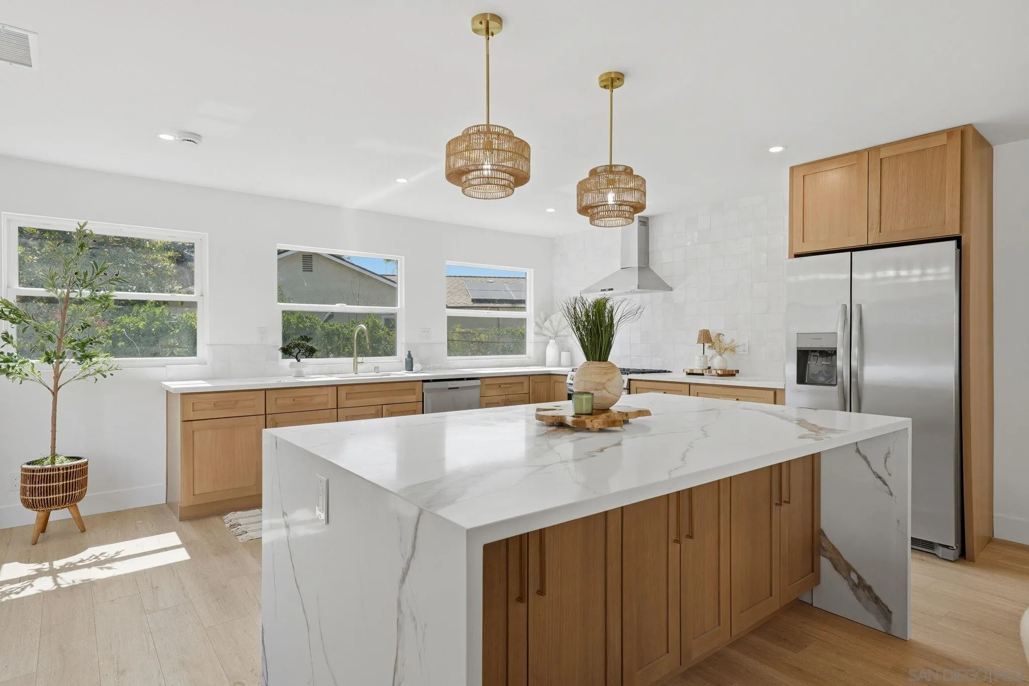 10440 Bosque Drive Lakeside, CA 92040 - Photo 12 of 47 a kitchen with stainless steel appliances granite countertop a sink a window and chairs