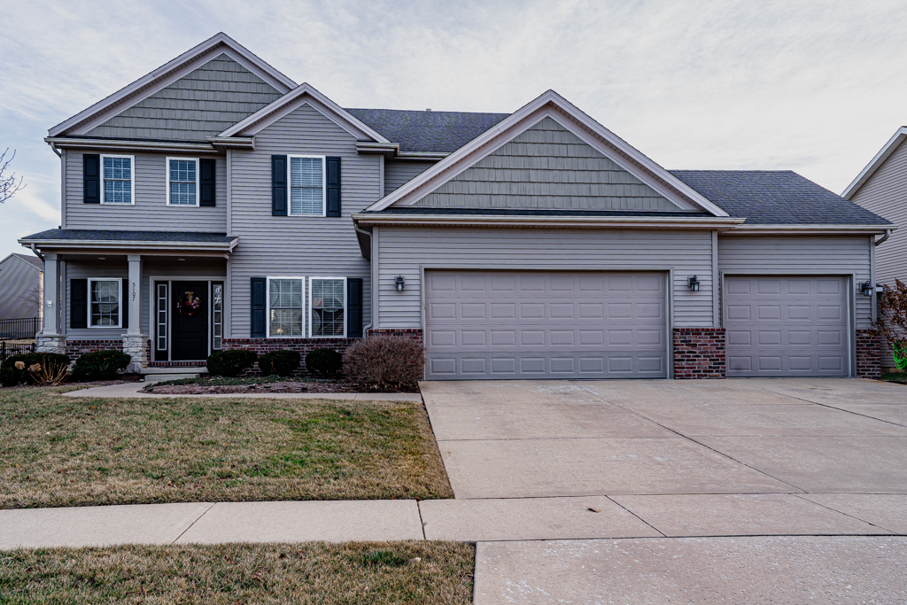 front view of a house with a yard