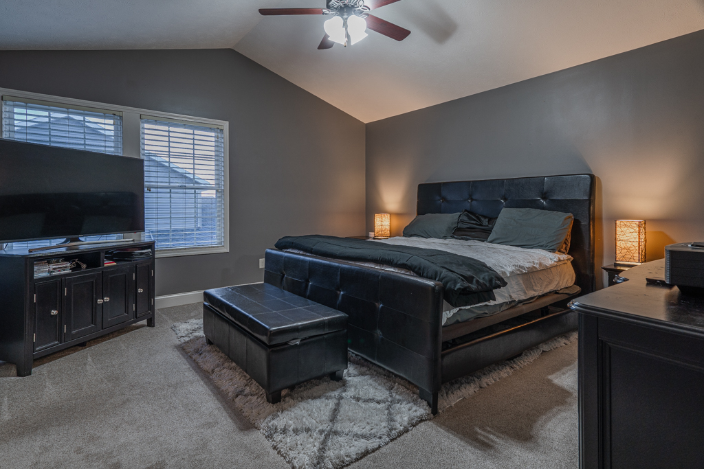 5107 Longfield Road Bloomington, IL 61705 - Photo 12 of 25 a living room with furniture and a flat screen tv