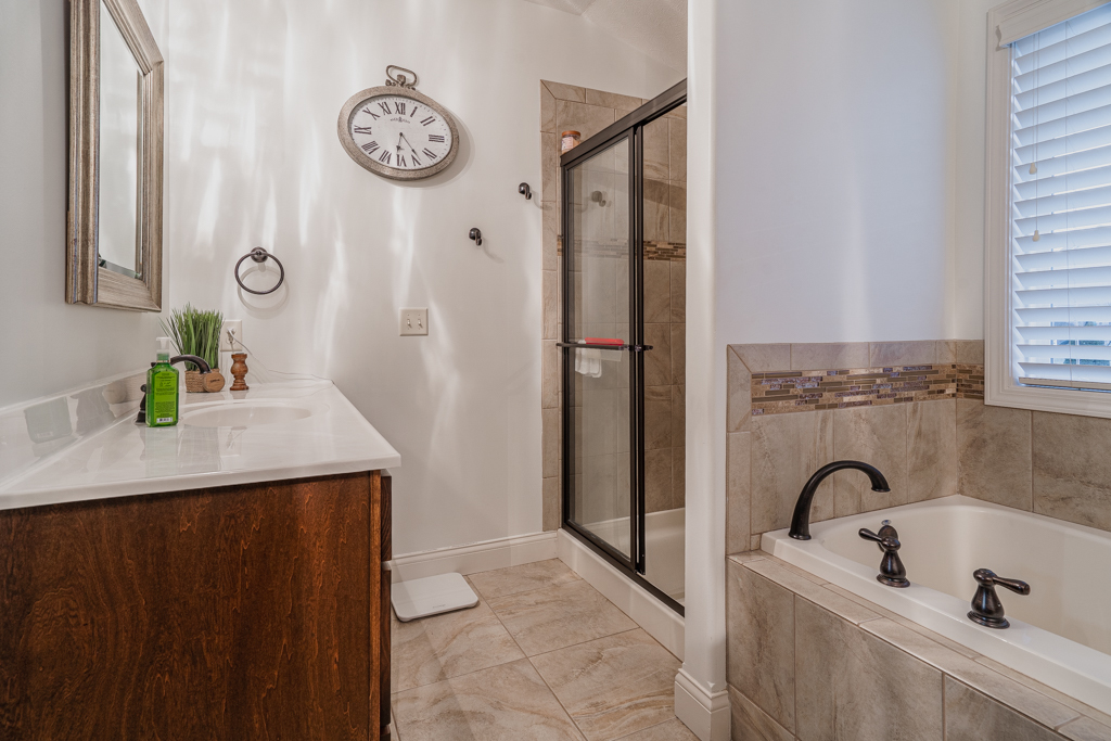 5107 Longfield Road Bloomington, IL 61705 - Photo 14 of 25 a view of bathroom with a sink and a mirror
