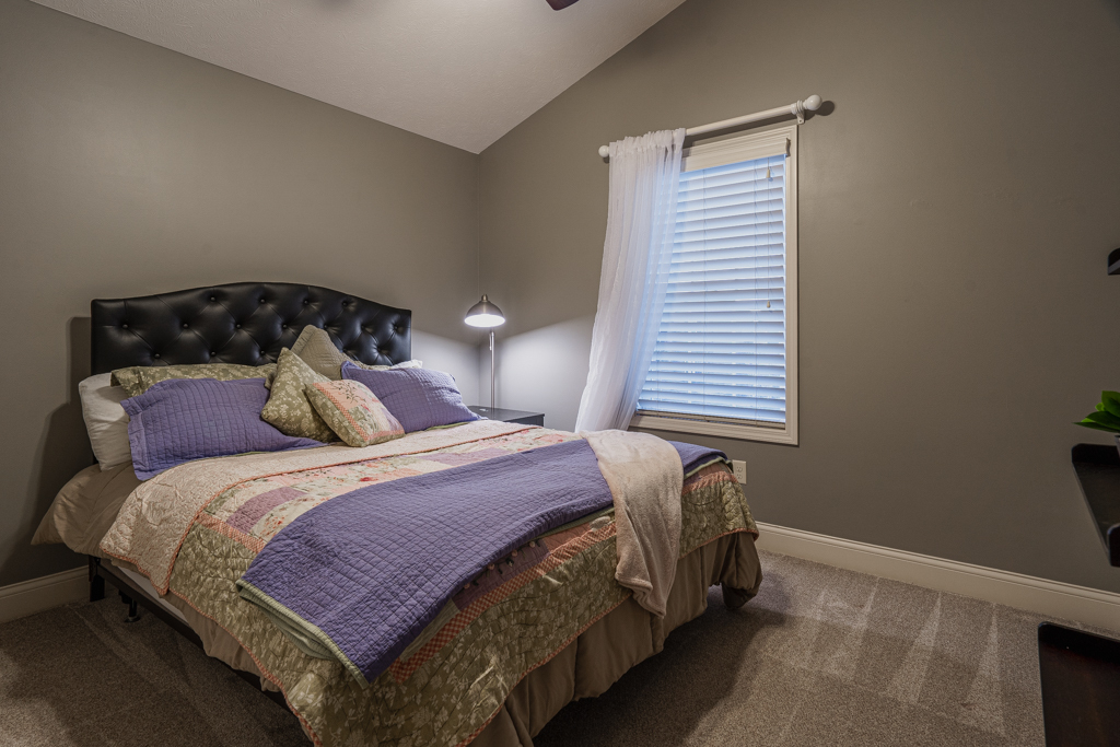 5107 Longfield Road Bloomington, IL 61705 - Photo 18 of 25 a bedroom with a bed and window