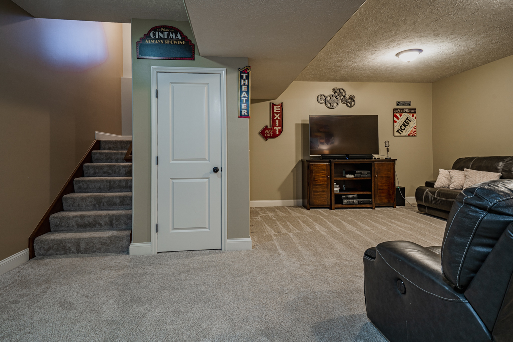 5107 Longfield Road Bloomington, IL 61705 - Photo 5 of 25 a view of livingroom with furniture and a flat screen tv