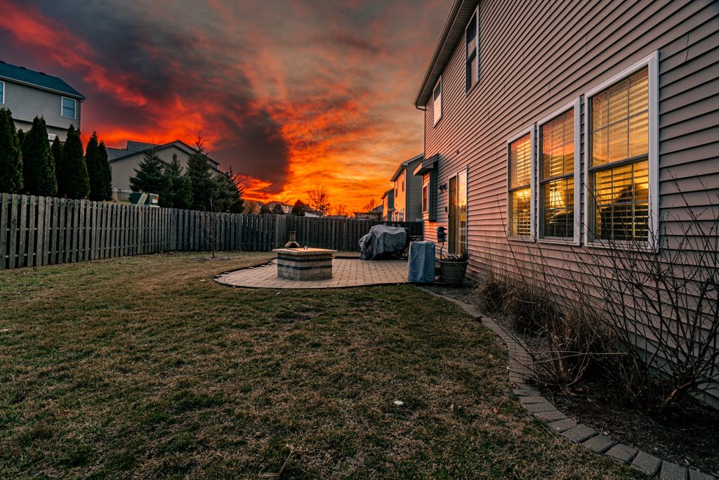 5107 Longfield Road Bloomington, IL 61705 - Photo 6 of 25 a backyard of a house with lots of green space