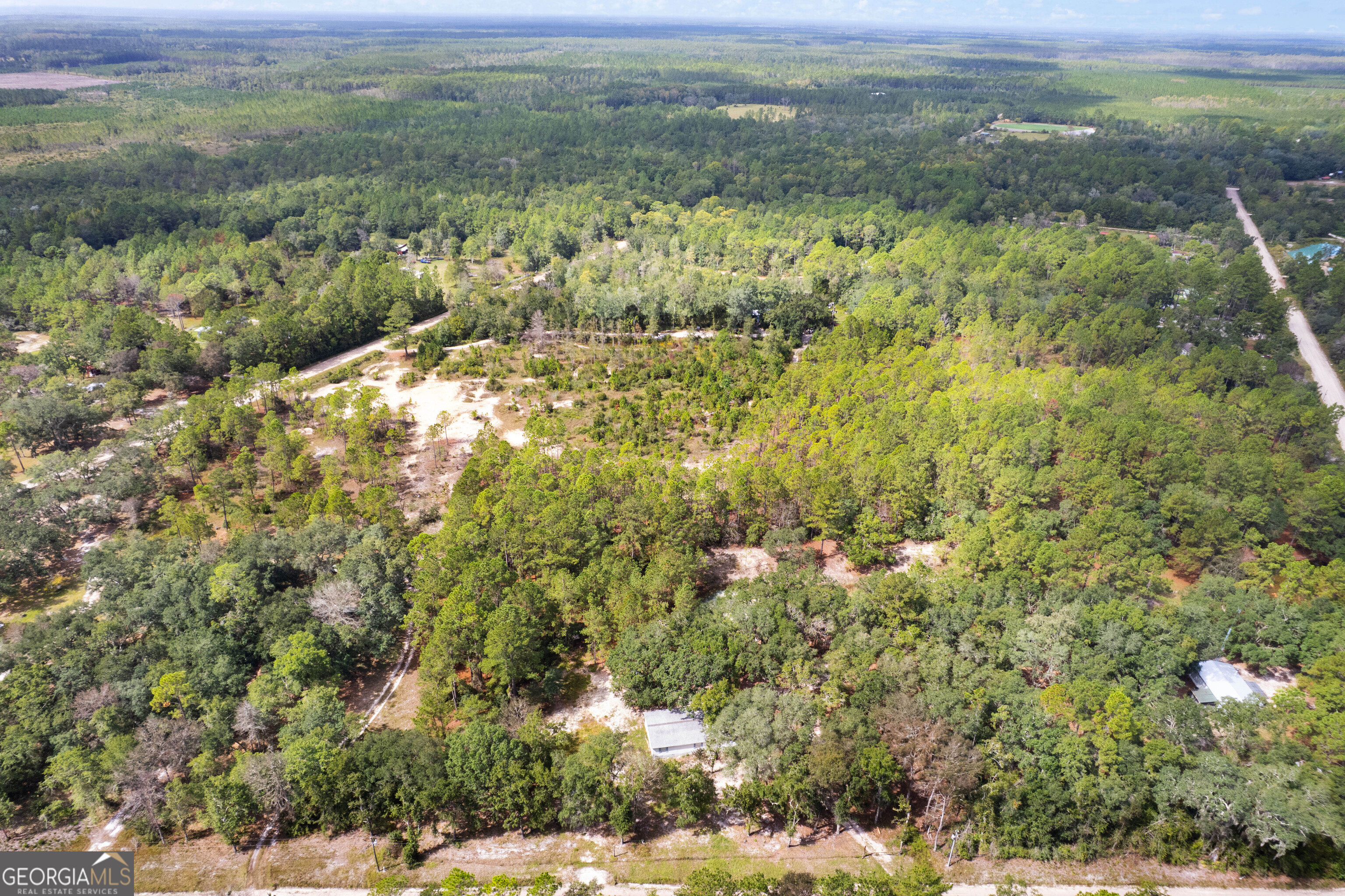 68 Amber Drive Waverly, GA 31565 - Photo 11 of 39 a view of a yard with an outdoor space