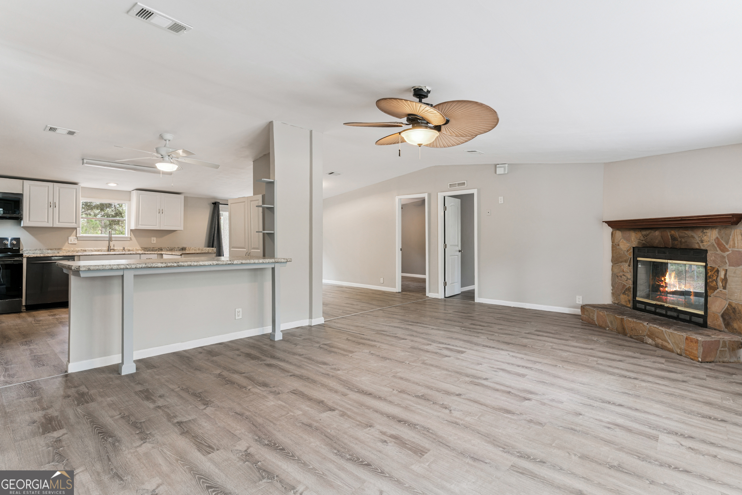 68 Amber Drive Waverly, GA 31565 - Photo 13 of 39 a view of a kitchen and an empty room