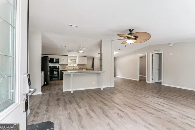 a view of kitchen with cabinets and stainless steel appliances
