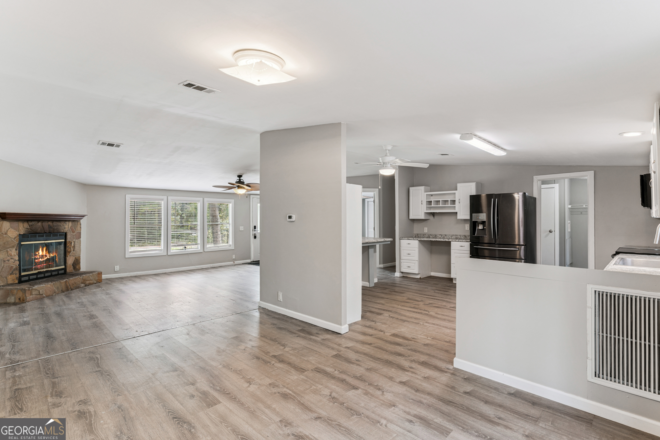 68 Amber Drive Waverly, GA 31565 - Photo 17 of 39 a view of a kitchen with furniture and wooden floor