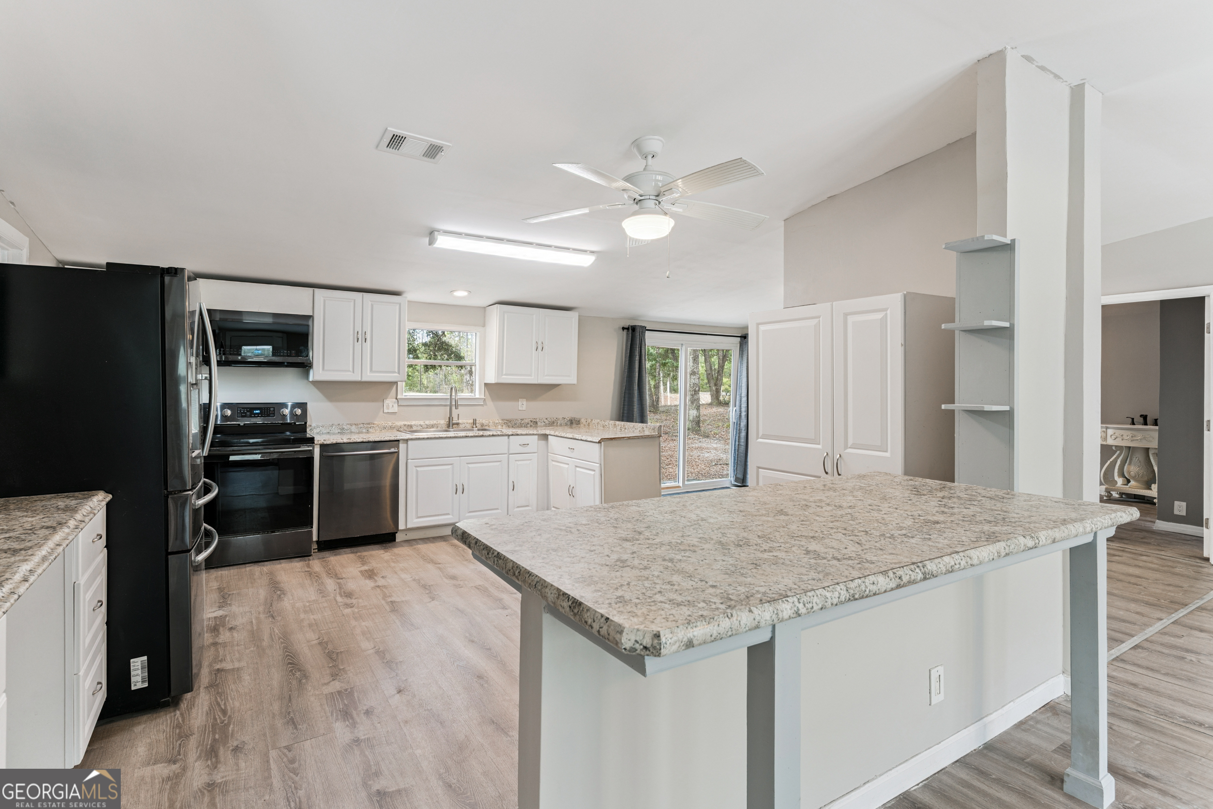 68 Amber Drive Waverly, GA 31565 - Photo 23 of 39 a kitchen with a stove a refrigerator and a sink