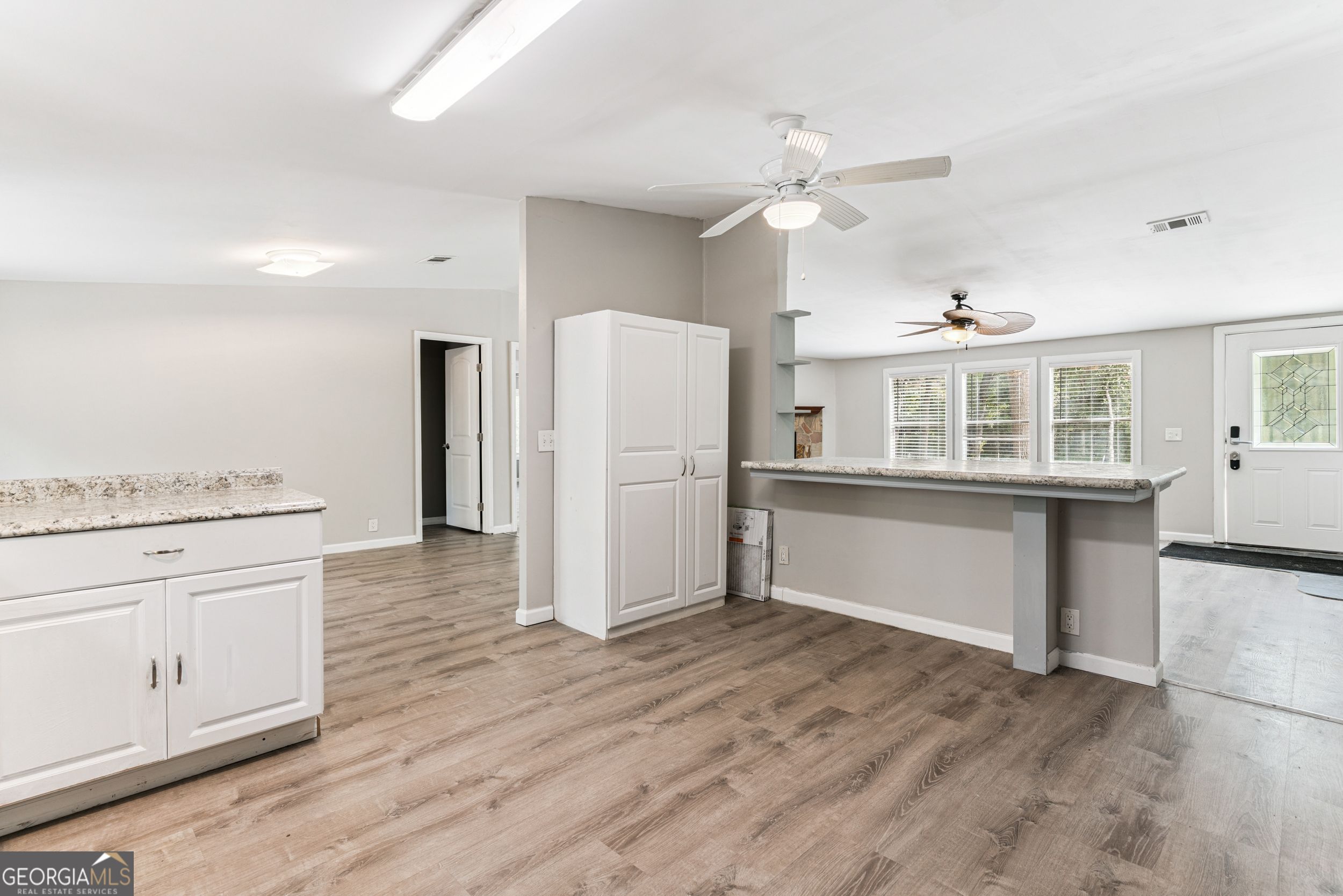 68 Amber Drive Waverly, GA 31565 - Photo 24 of 39 a kitchen with stainless steel appliances granite countertop a refrigerator and a stove top oven