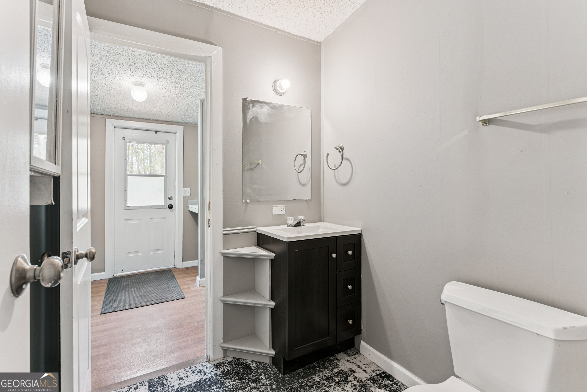 68 Amber Drive Waverly, GA 31565 - Photo 25 of 39 a bathroom with a sink and a mirror