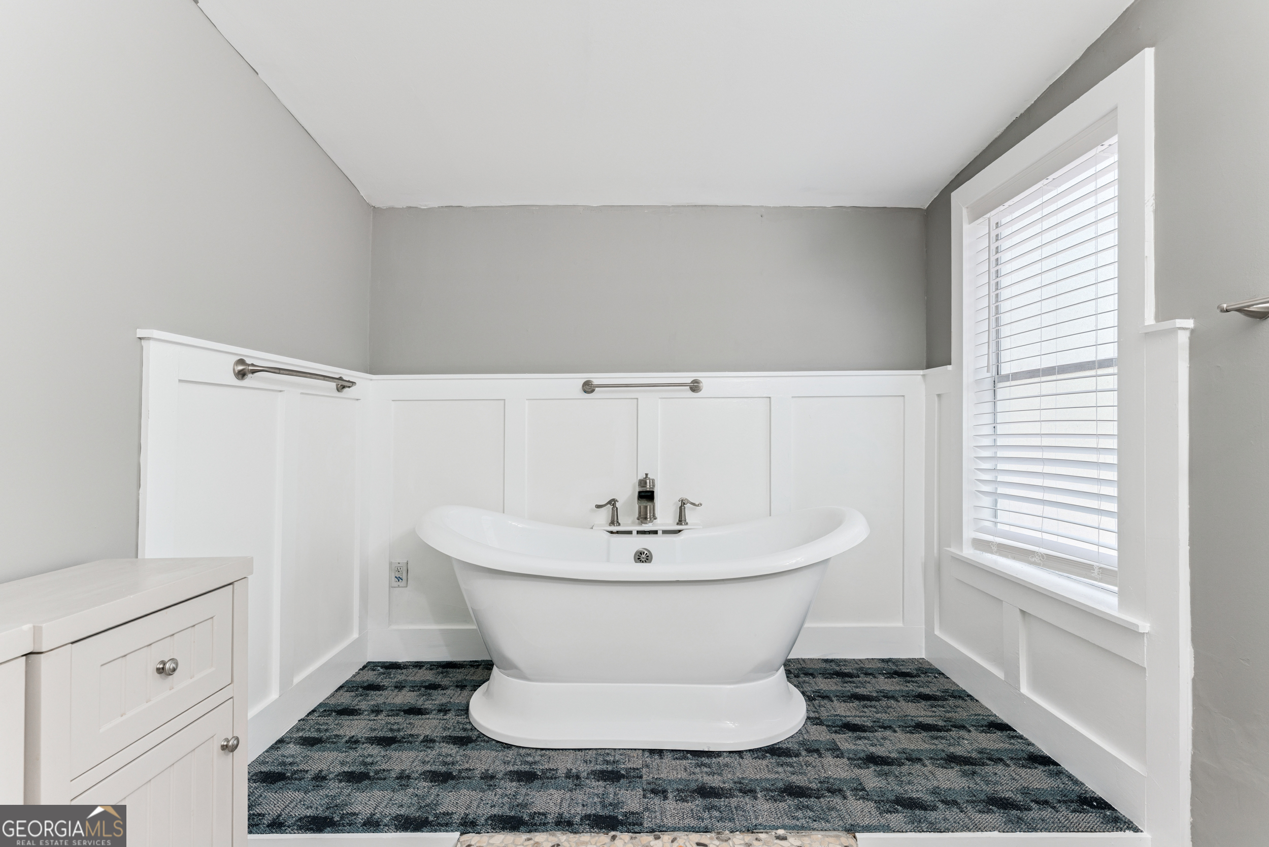 68 Amber Drive Waverly, GA 31565 - Photo 29 of 39 a bathroom with a sink and a mirror