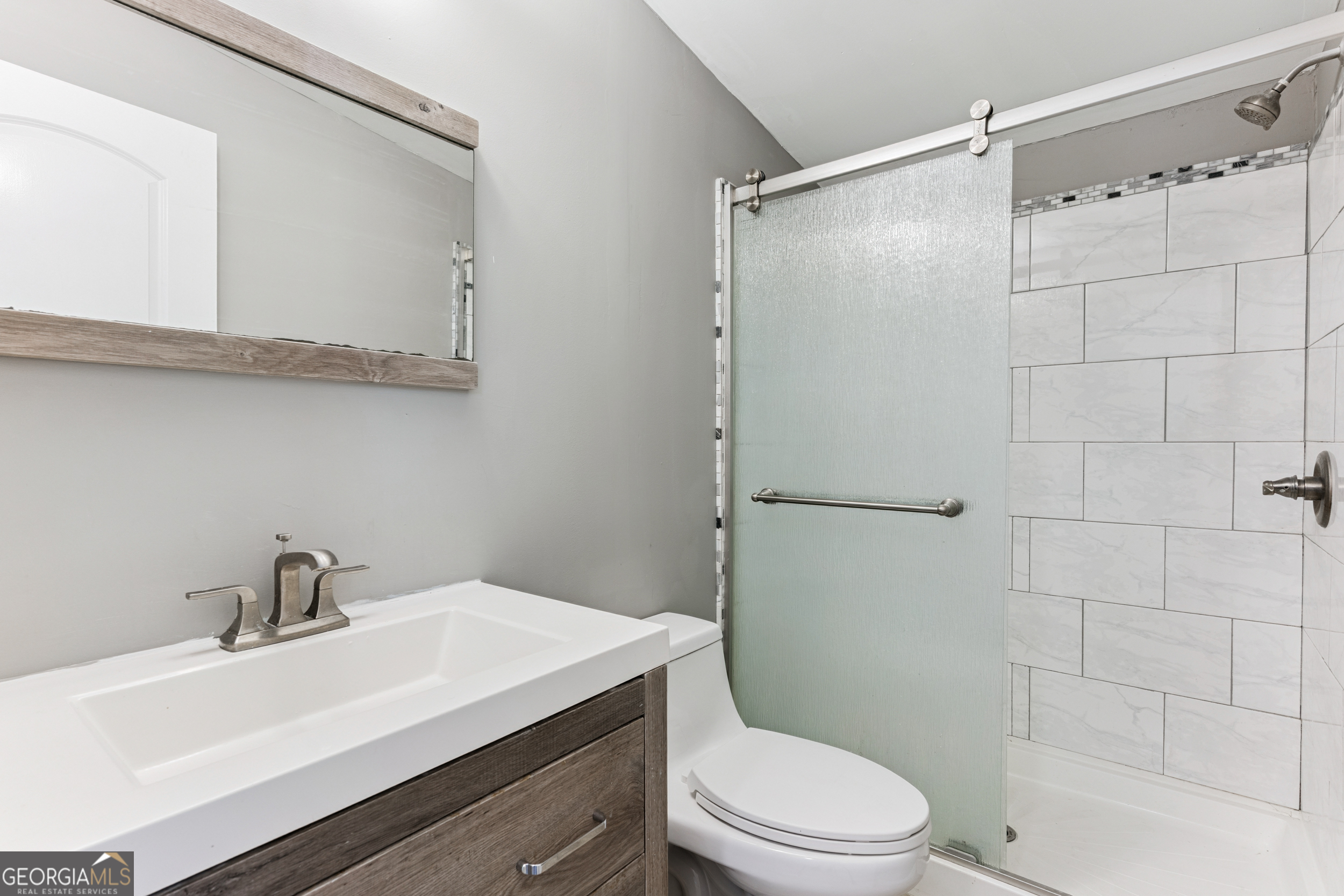 68 Amber Drive Waverly, GA 31565 - Photo 30 of 39 a bathroom with a sink a toilet and shower