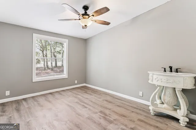 a view of an empty room with a window