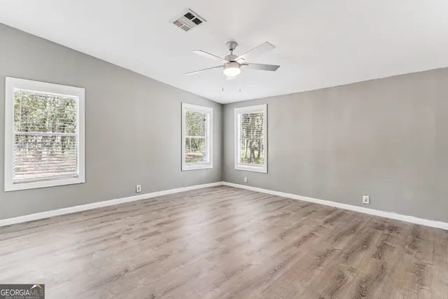 a view of an empty room with a window