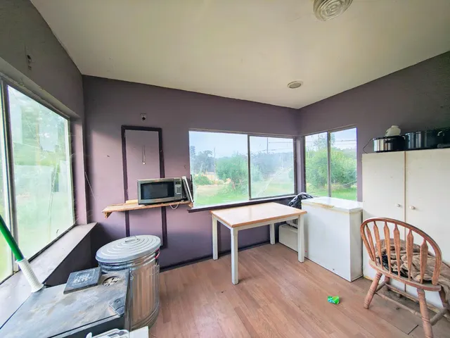 a room with furniture and wooden floor