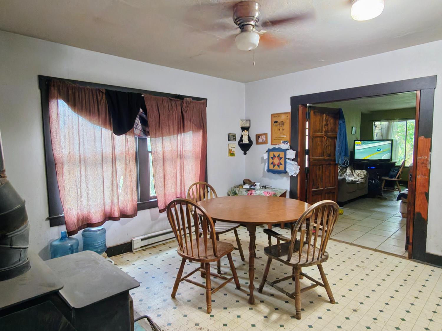 5661 Thompson Hill Road Placerville, CA 95667 - Photo 32 of 68 a view of a dining room with furniture and a chandelier