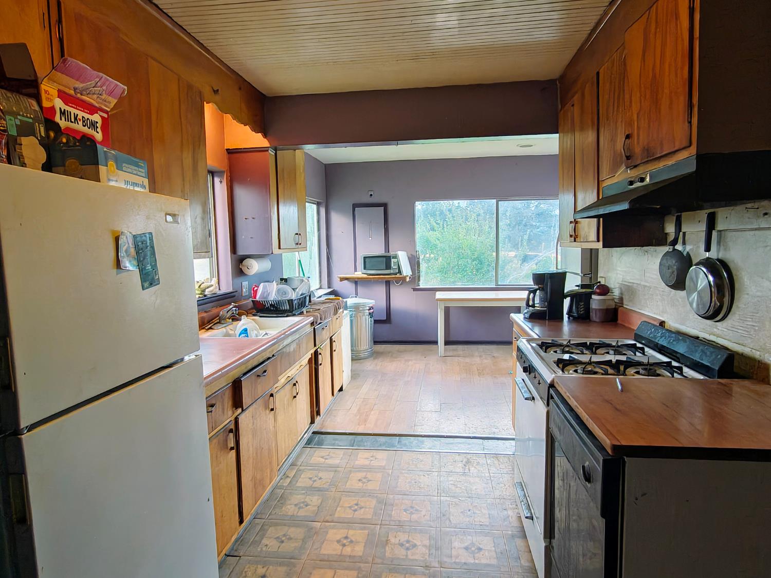 5661 Thompson Hill Road Placerville, CA 95667 - Photo 34 of 68 a kitchen with stainless steel appliances granite countertop a stove a sink and a refrigerator