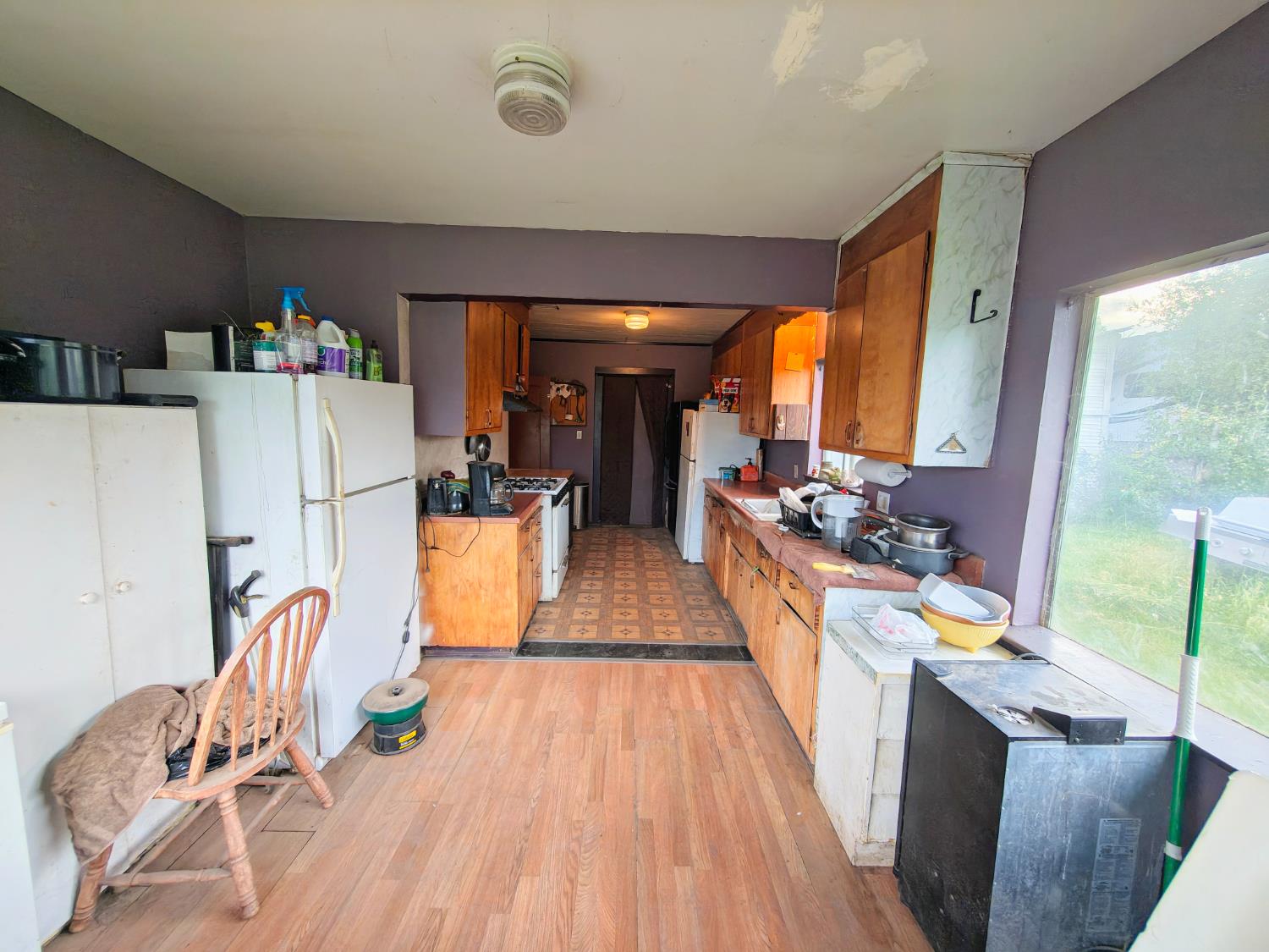5661 Thompson Hill Road Placerville, CA 95667 - Photo 35 of 68 a kitchen with stainless steel appliances granite countertop a refrigerator a stove top oven a dining table and chairs