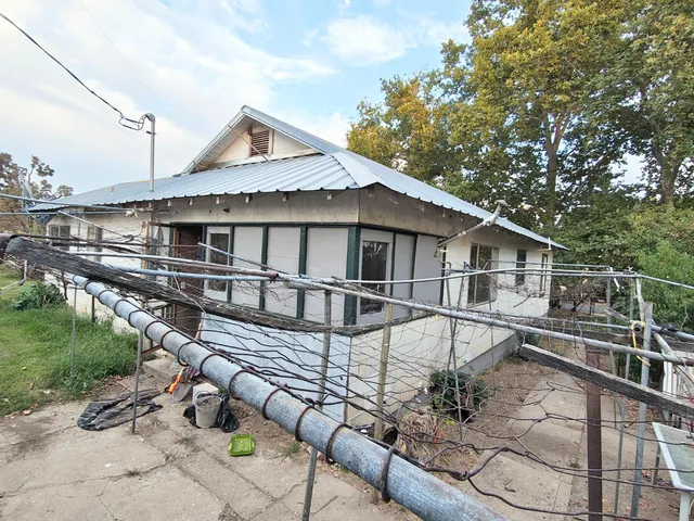 a front view of house with garden