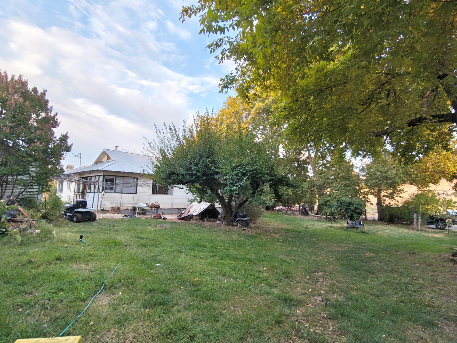 5661 Thompson Hill Road Placerville, CA 95667 - Photo 57 of 68 a view of a house with a big yard and large trees