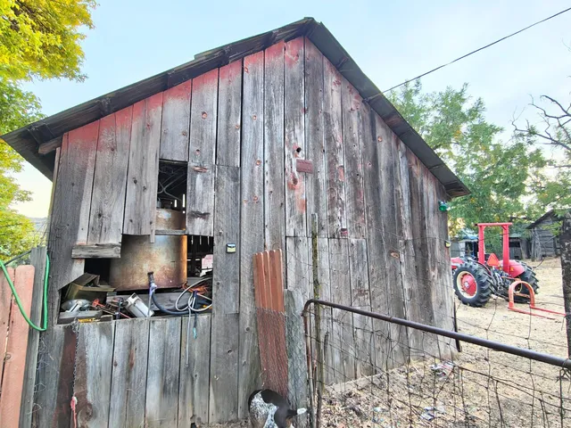 an aerial view of house with a yard