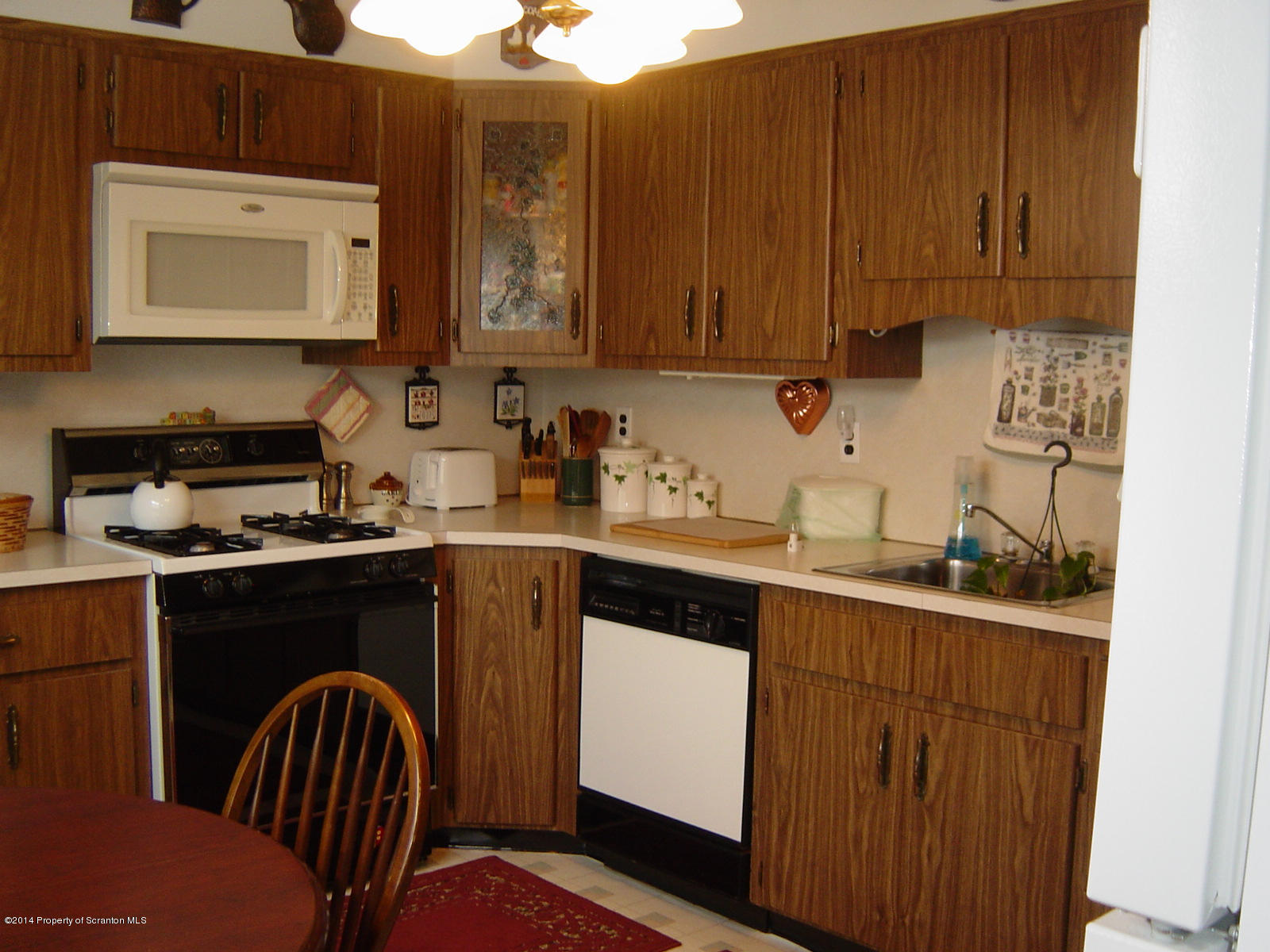 17 T Rte 318 Moscow, PA 18444 - Photo 15 of 30 a kitchen with stainless steel appliances granite countertop a sink stove and microwave