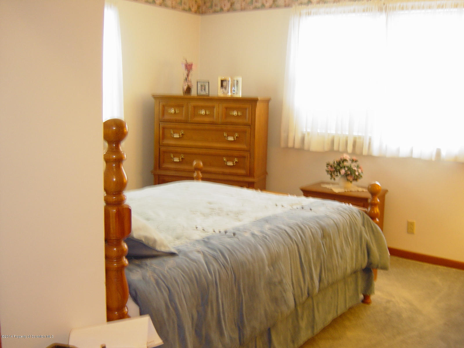 17 T Rte 318 Moscow, PA 18444 - Photo 16 of 30 a bed sitting in a bedroom next to a window