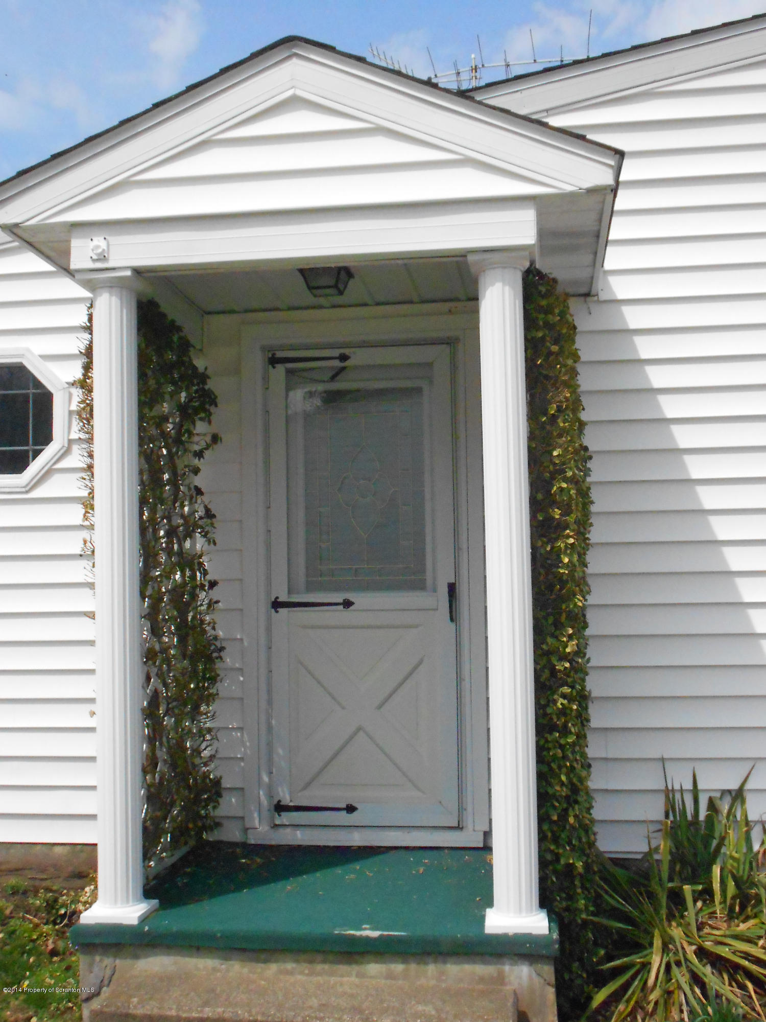 17 T Rte 318 Moscow, PA 18444 - Photo 4 of 30 a view of front door and potted plants