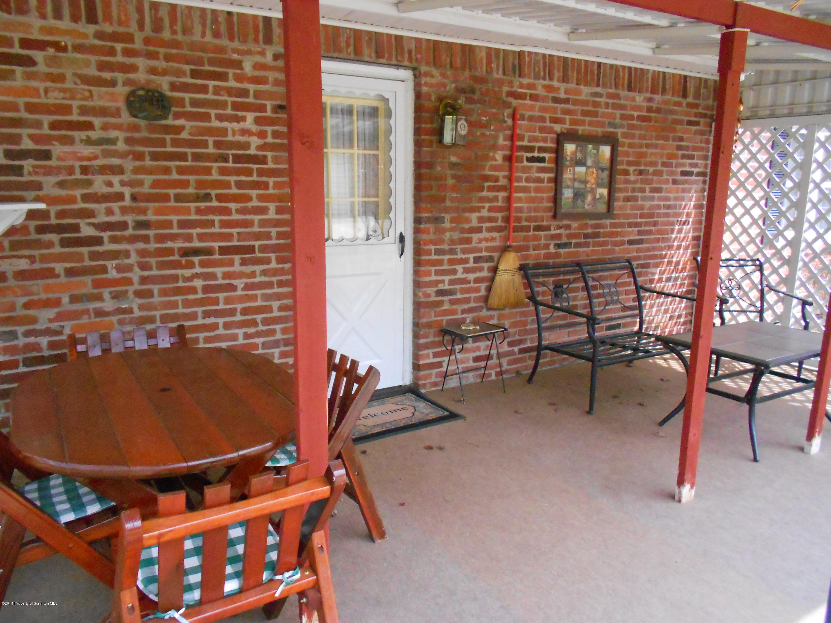17 T Rte 318 Moscow, PA 18444 - Photo 7 of 30 a balcony with table and chairs