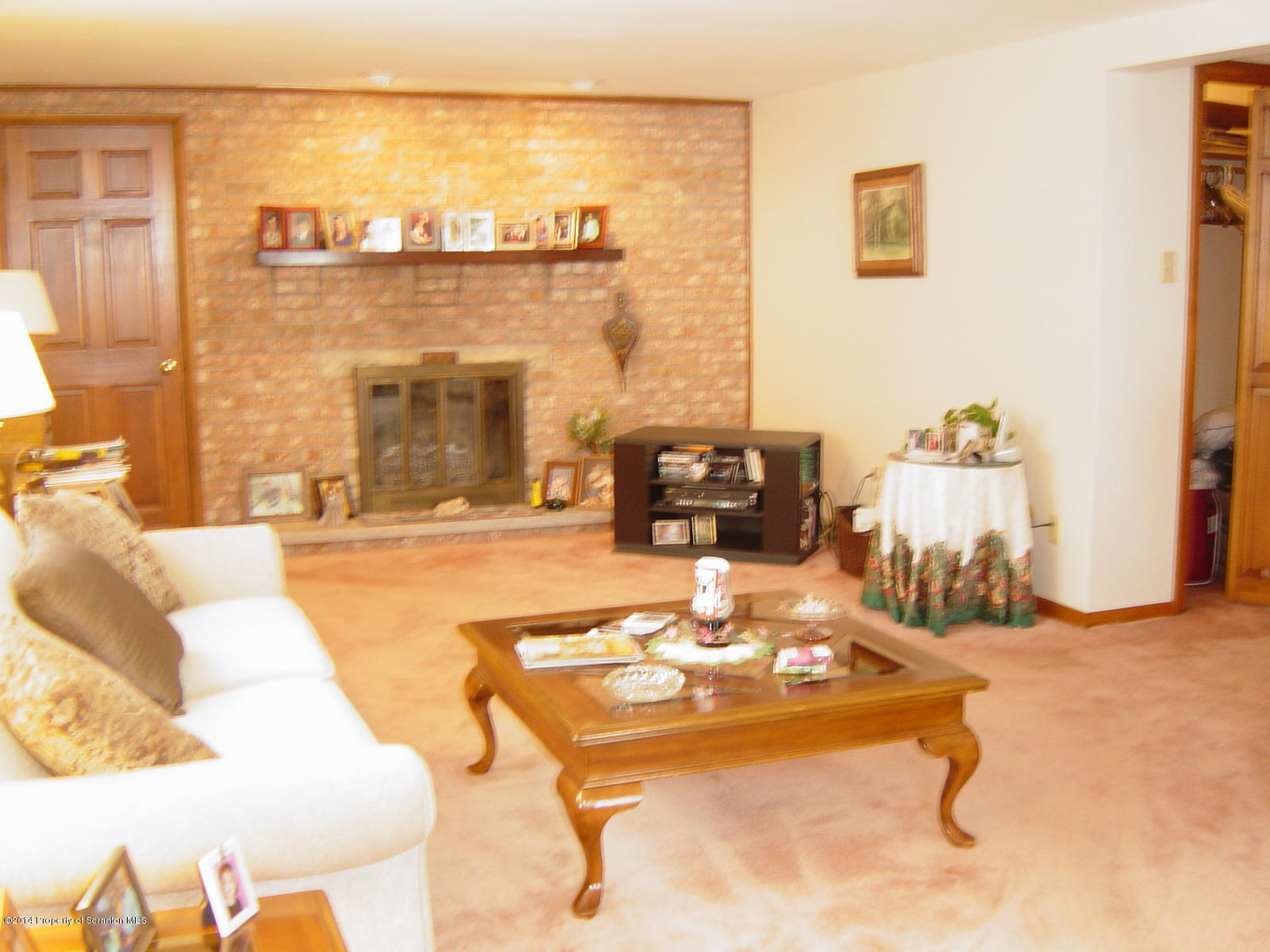 17 T Rte 318 Moscow, PA 18444 - Photo 9 of 30 a living room with patio furniture and a fireplace