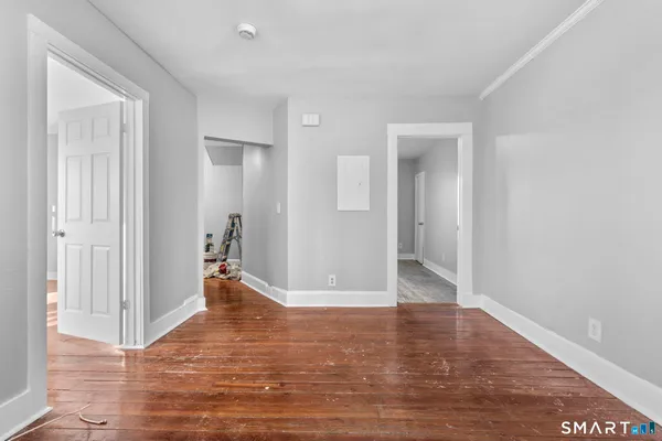 a view of a room with wooden floor and chair