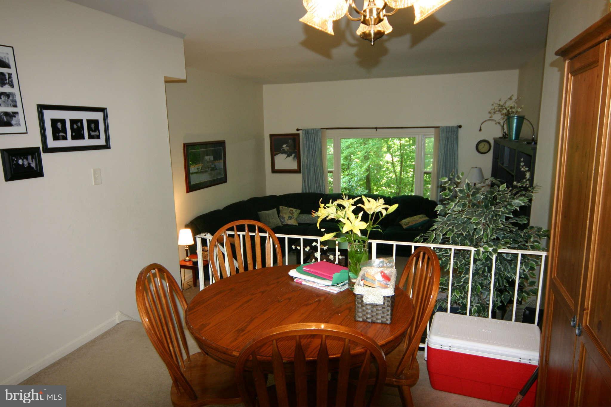 5915 Kingsford Road, Unit 365 Springfield, VA 22152 - Photo 5 of 17 a view of a dining room with furniture window and outside view