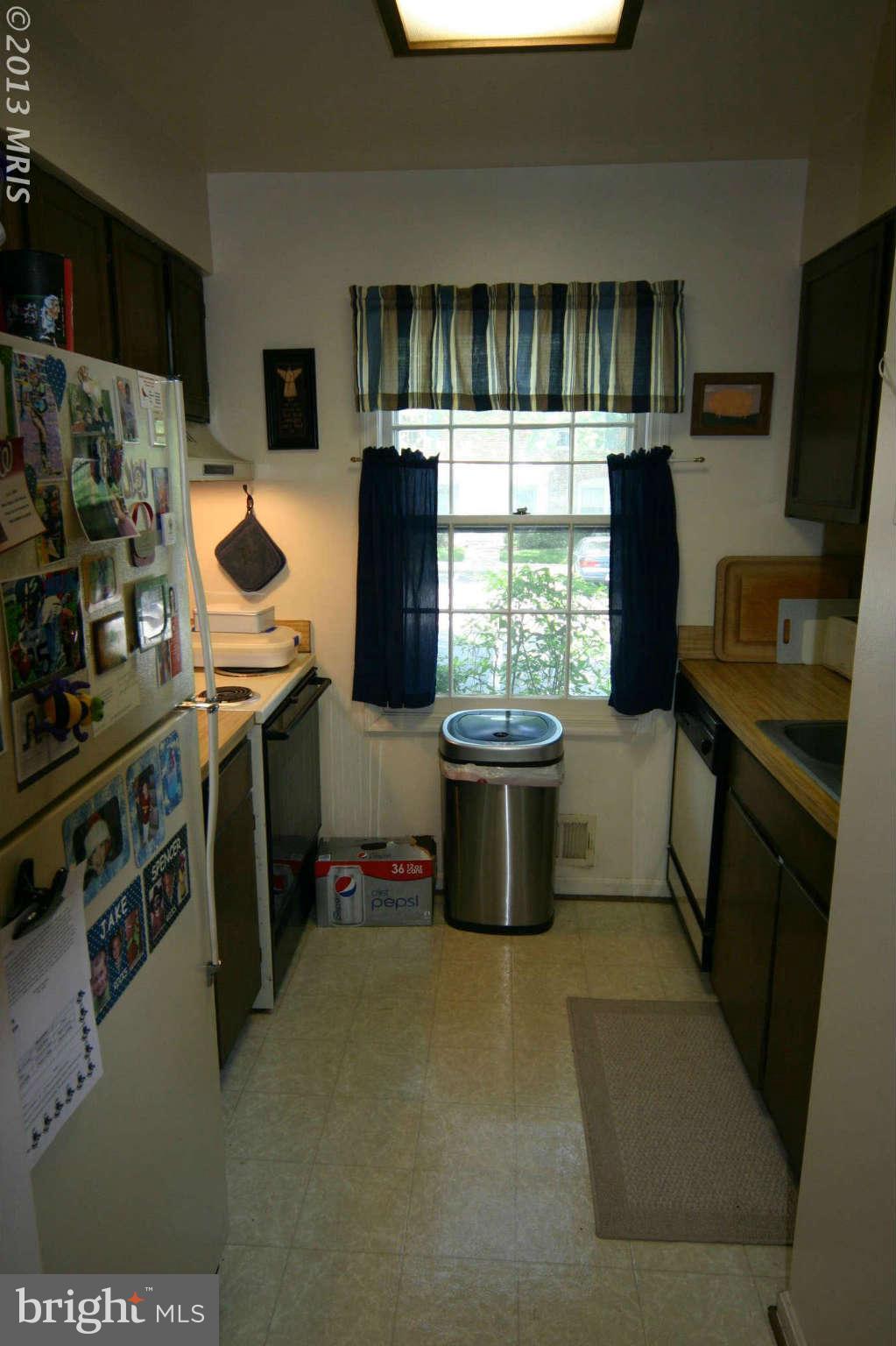 5915 Kingsford Road, Unit 365 Springfield, VA 22152 - Photo 9 of 17 a kitchen with stainless steel appliances a stove a refrigerator a sink a stove and a refrigerator