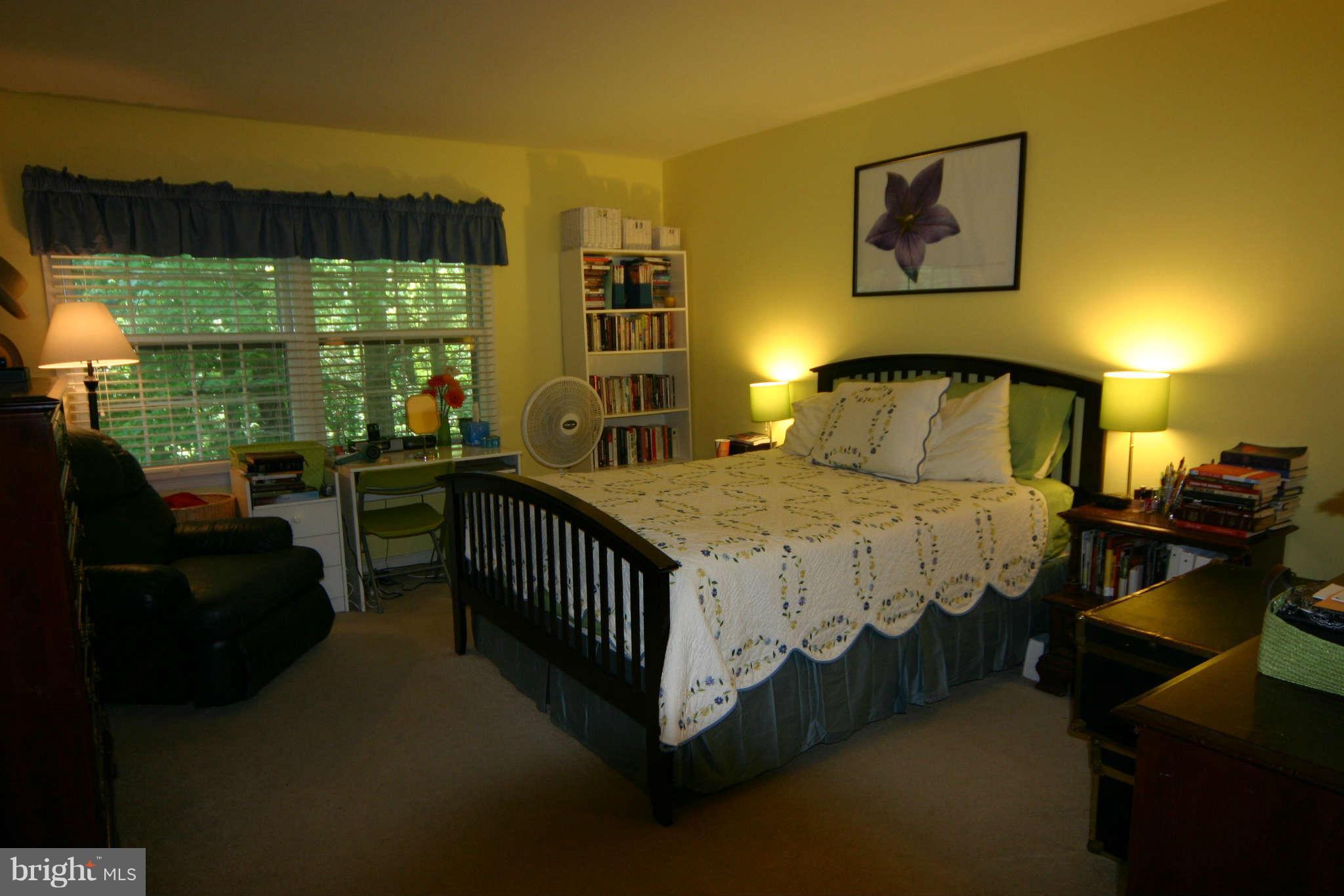 5915 Kingsford Road, Unit 365 Springfield, VA 22152 - Photo 10 of 17 a bed sitting in a bedroom next to a window