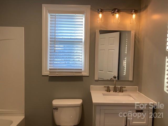 1599 Springdale Road Lancaster, SC 29720 - Photo 14 of 28 a bathroom with a toilet sink and mirror