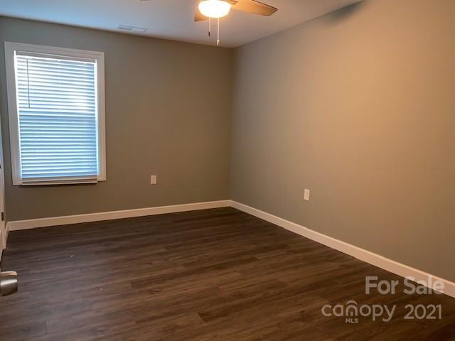 1599 Springdale Road Lancaster, SC 29720 - Photo 17 of 28 a view of an empty room with wooden floor and a window